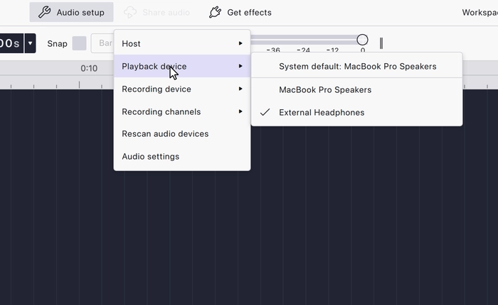 The Playback device submenu expanded, listing the system default and the available outputs